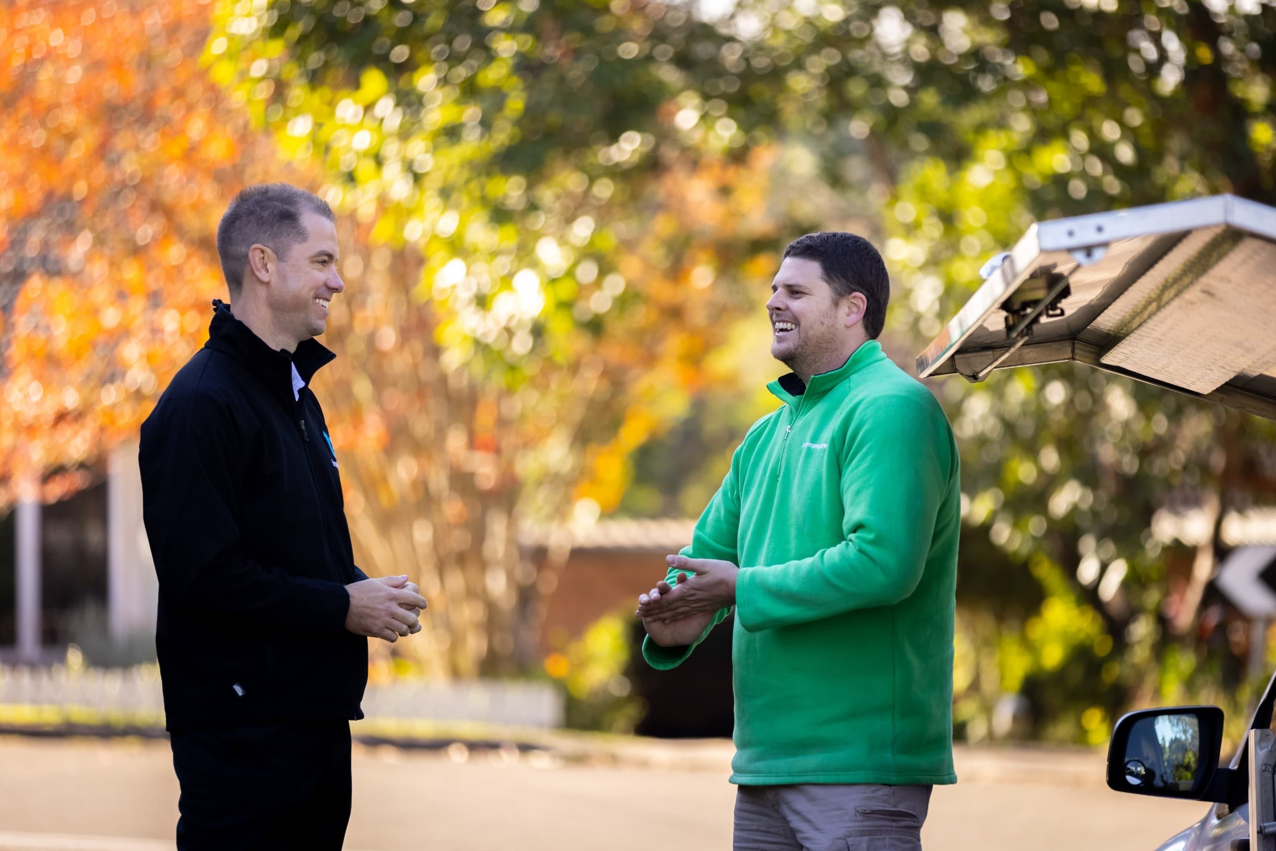 Jared Dawson talking with a trade business owner on site